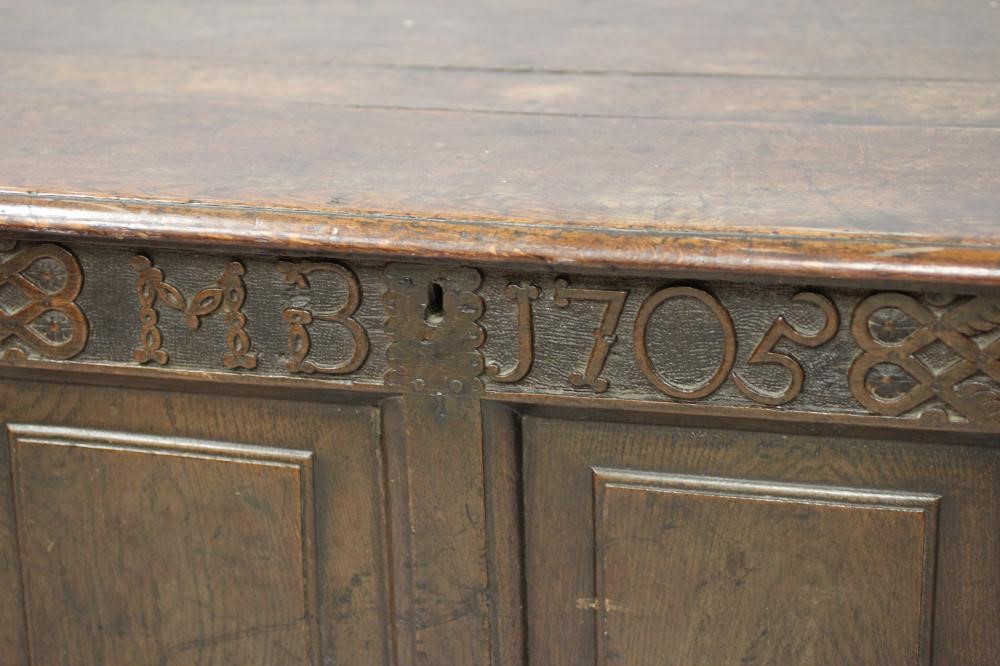 AN OAK PANELLED COFFER Image