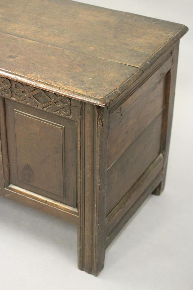 AN OAK PANELLED COFFER Image