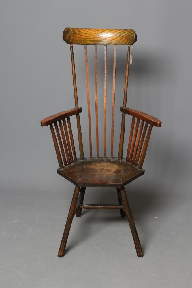 A COMB BACK WINDSOR ARMCHAIR Image