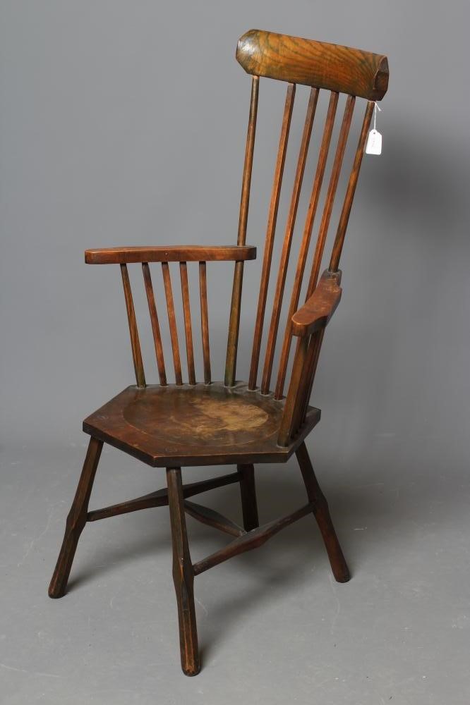 A COMB BACK WINDSOR ARMCHAIR Image