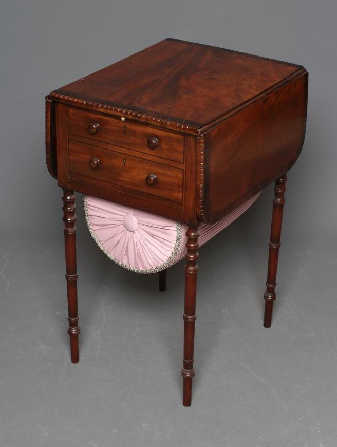 A REGENCY MAHOGANY AND ROSEWOOD BANDED WORK TABLE Image