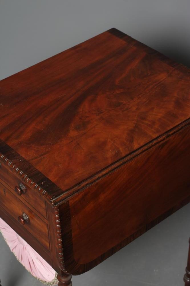 A REGENCY MAHOGANY AND ROSEWOOD BANDED WORK TABLE Image