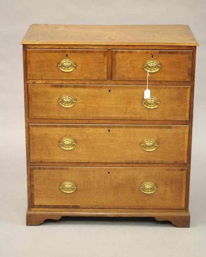 AN OAK AND MAHOGANY BANDED CHEST Image