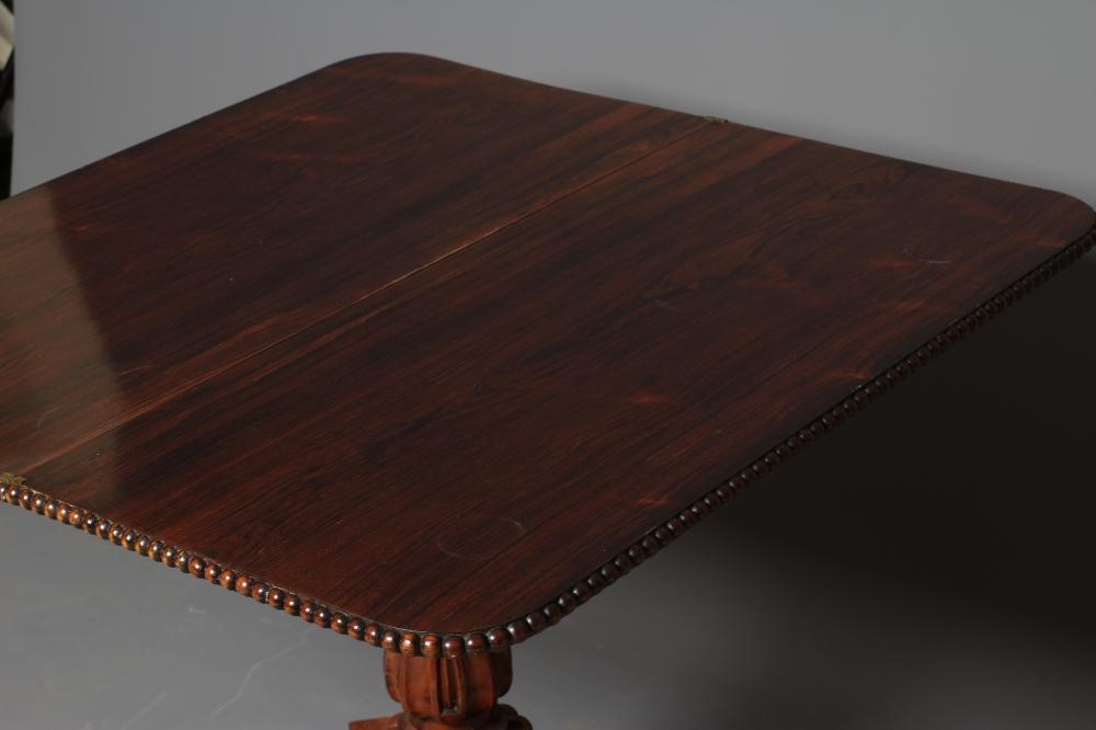 A GEORGE IV ROSEWOOD FOLDING TEA TABLE Image