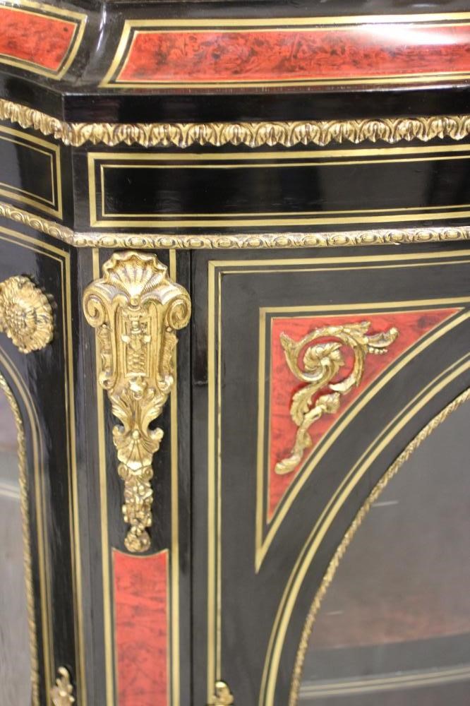 A VICTORIAN EBONISED AND RED TORTOISESHELL CREDENZA of bold serpentine outline with brass inlay and Image