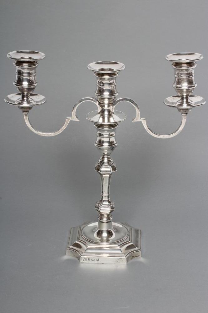 A GEORGE II STYLE TWO BRANCH THREE LIGHT SILVER CANDELABRUM Image