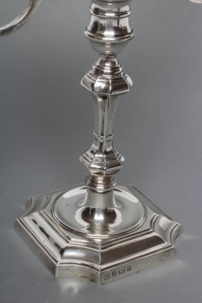 A GEORGE II STYLE TWO BRANCH THREE LIGHT SILVER CANDELABRUM Image