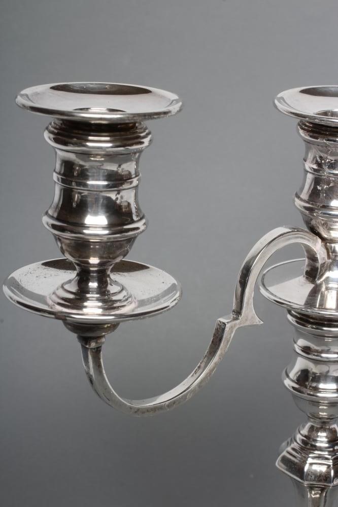 A GEORGE II STYLE TWO BRANCH THREE LIGHT SILVER CANDELABRUM Image