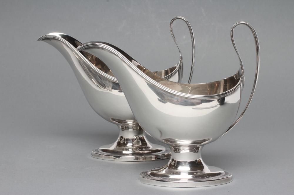 A PAIR OF SILVER PEDESTAL SAUCEBOATS Image
