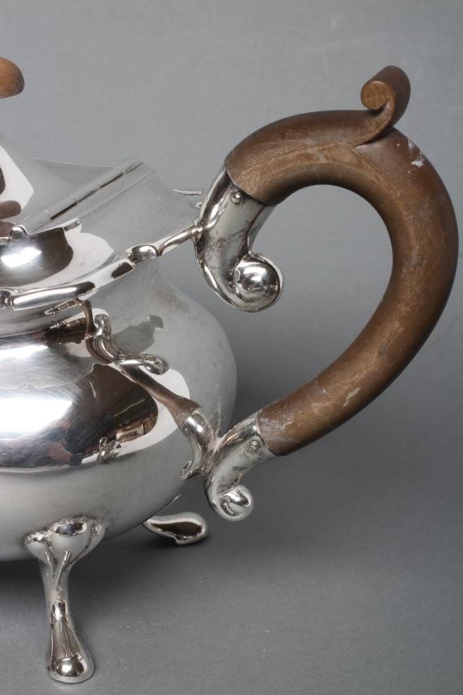A SILVER THREE PIECE TEA SERVICE Image