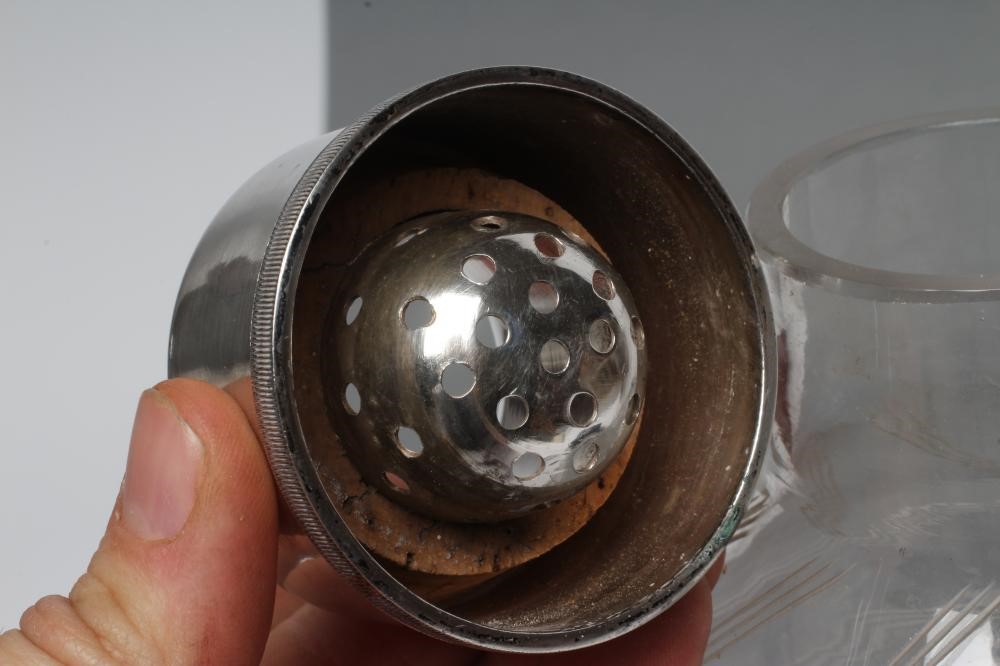 AN ART DECO SILVER MOUNTED CLEAR GLASS COCKTAIL SHAKER Image