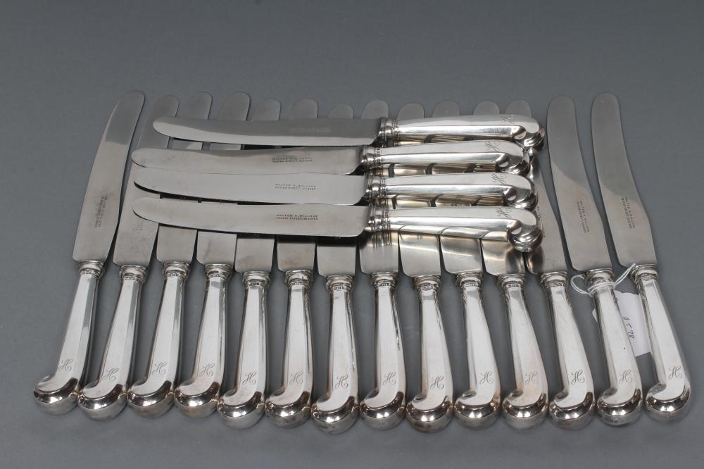A SET OF EIGHTEEN SILVER TABLE KNIVES Image