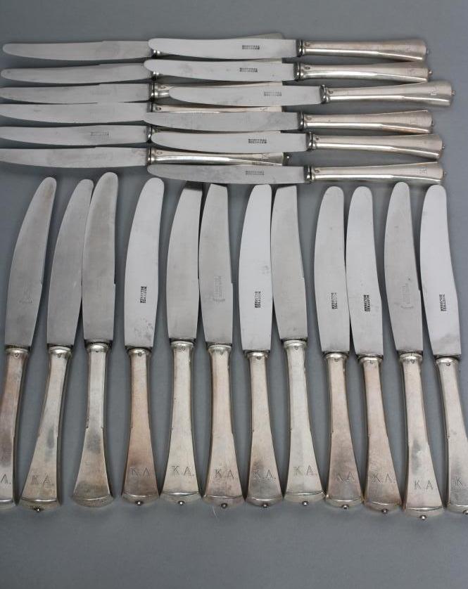 A SET OF TWELVE TABLE KNIVES Image