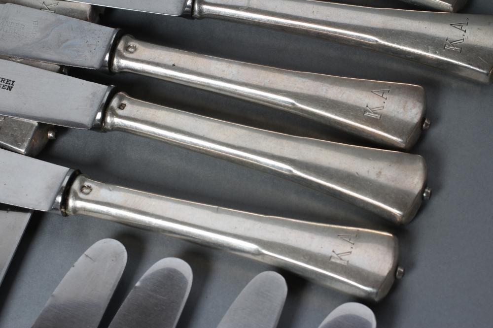 A SET OF TWELVE TABLE KNIVES Image