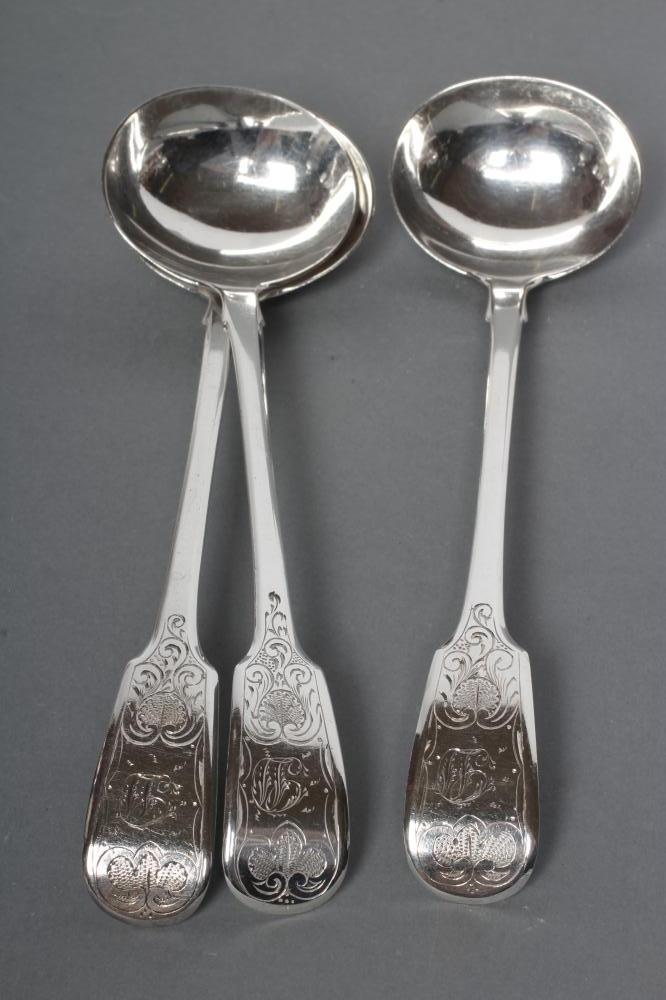 A SET OF THREE VICTORIAN SCOTTISH SILVER CREAM LADLES Image