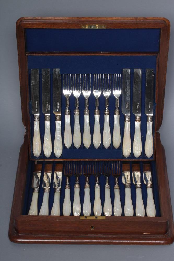 A SET OF TWELVE VICTORIAN SILVER DESSERT KNIVES AND FORKS Image
