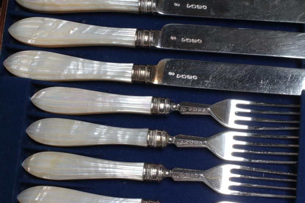 A SET OF TWELVE VICTORIAN SILVER DESSERT KNIVES AND FORKS Image