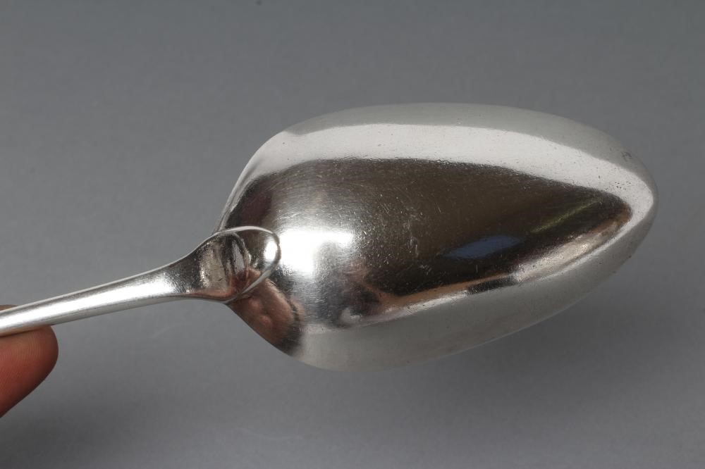 A GEORGE III SILVER STRAINER SPOON Image