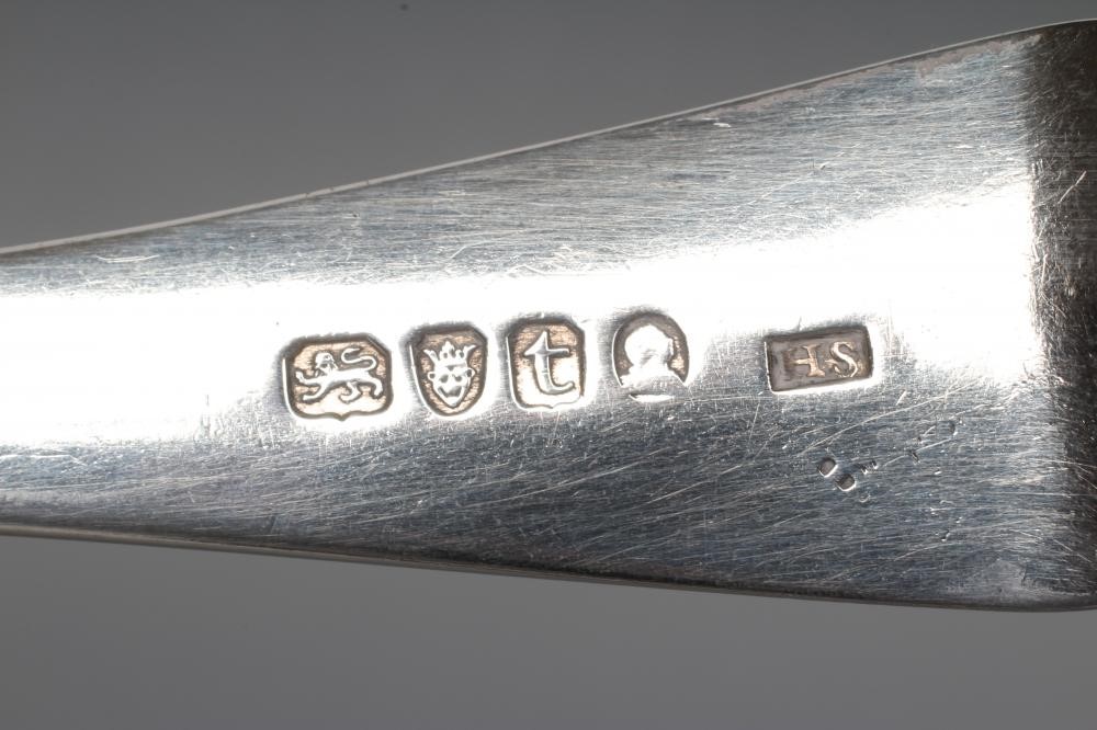 A GEORGE III SILVER STRAINER SPOON Image