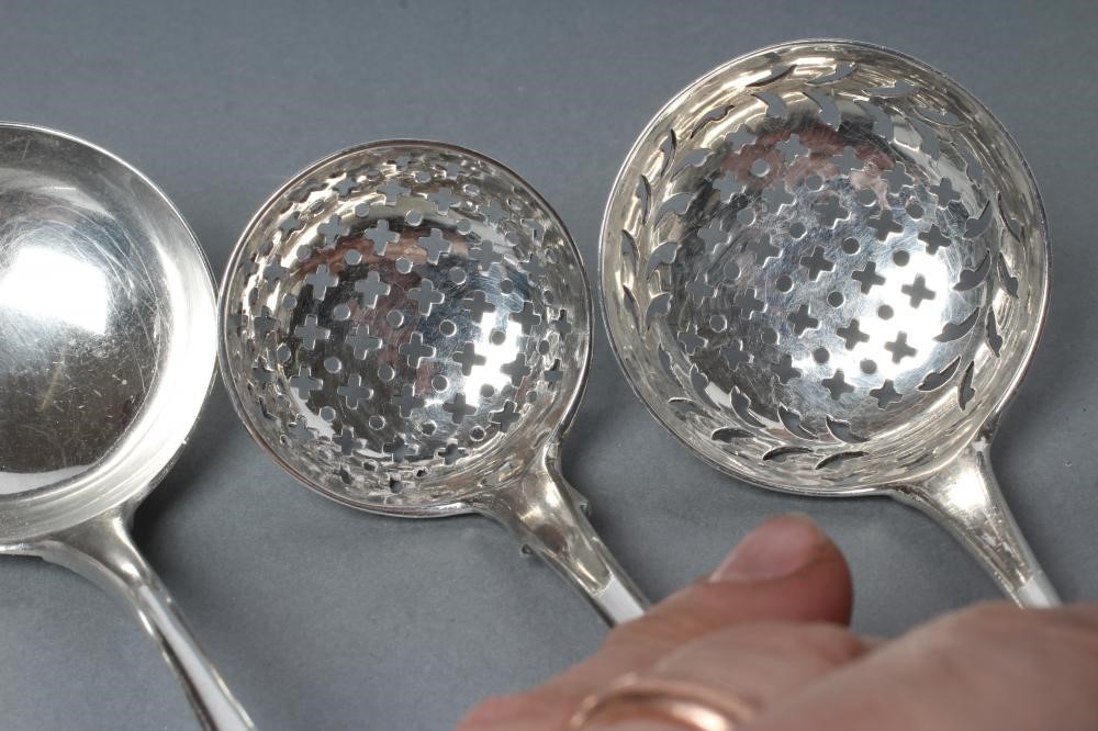 A PAIR OF EDWARDIAN SILVER CREAM LADLES Image