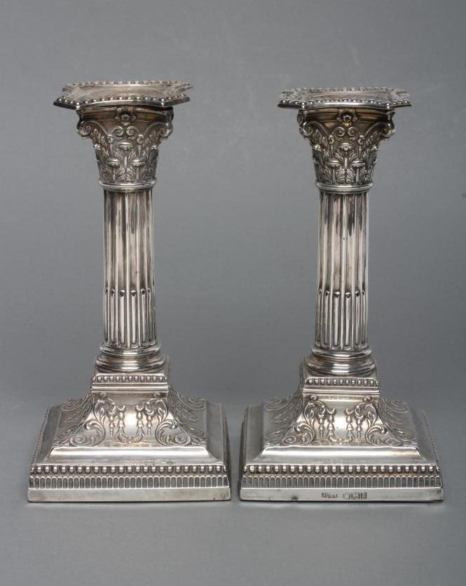 A PAIR OF LATE VICTORIAN SILVER CORINTHIAN COLUMN CANDLESTICKS Image