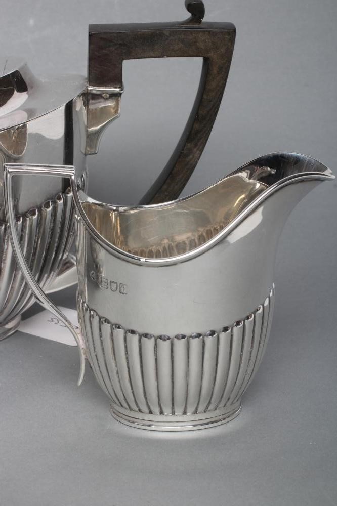 A SILVER COMPOSITE THREE PIECE TEA SERVICE Image