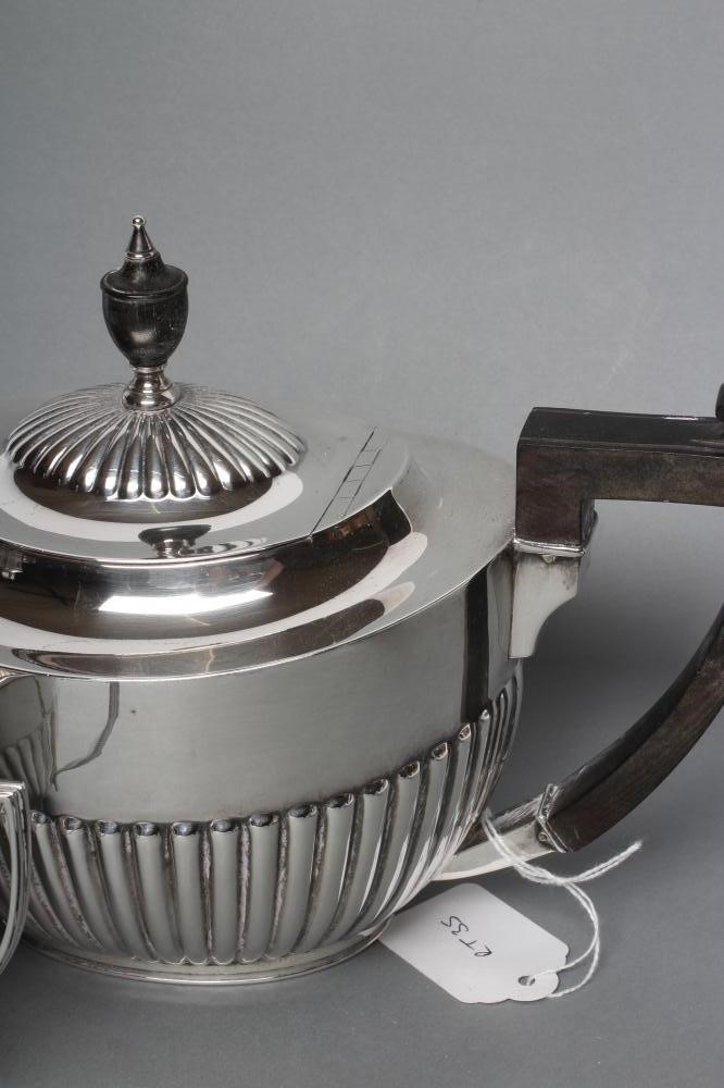 A SILVER COMPOSITE THREE PIECE TEA SERVICE Image