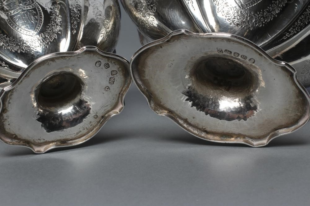 A GEORGE III SILVER SUGAR BASKET AND MATCHING CREAM BASKET Image
