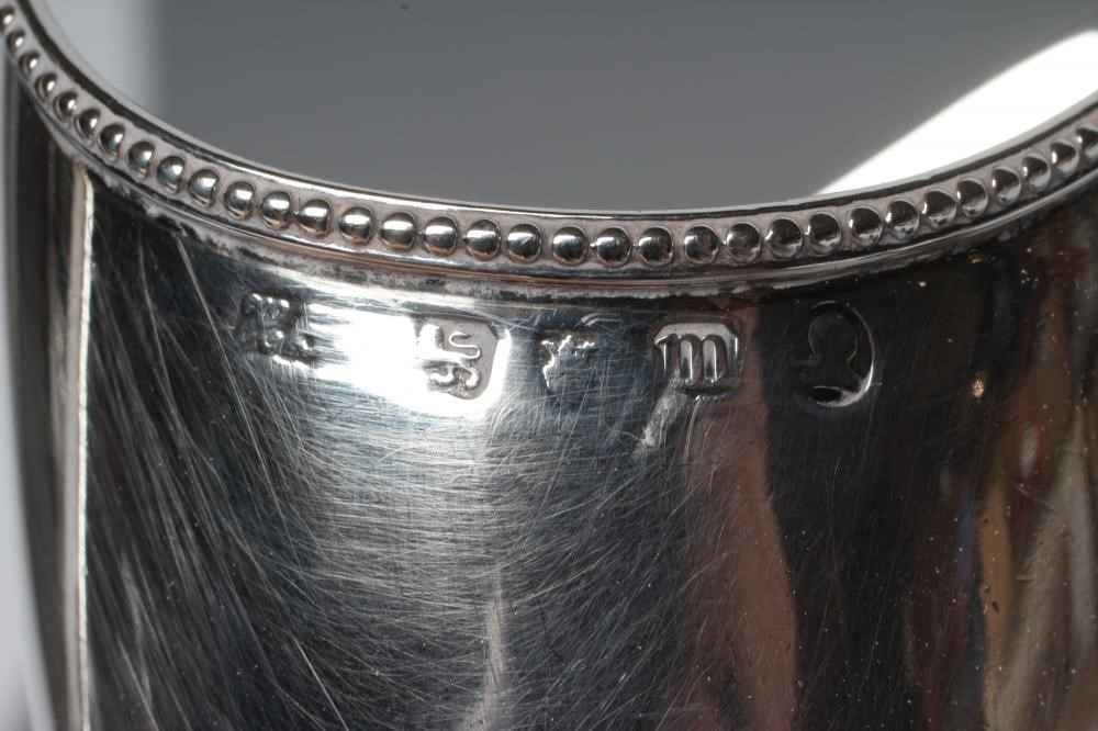 A GEORGE III SILVER HELMET MILK JUG Image