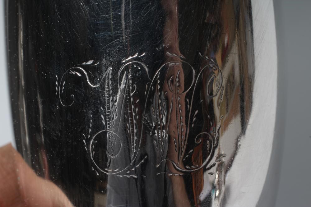 A GEORGE III SILVER HELMET MILK JUG Image