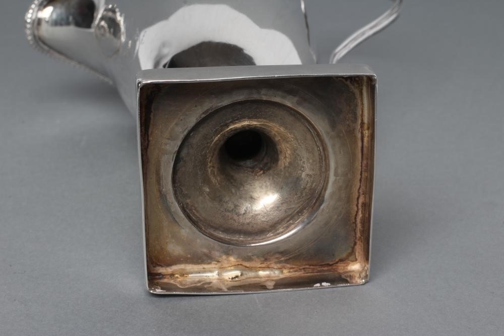 A GEORGE III SILVER HELMET MILK JUG Image