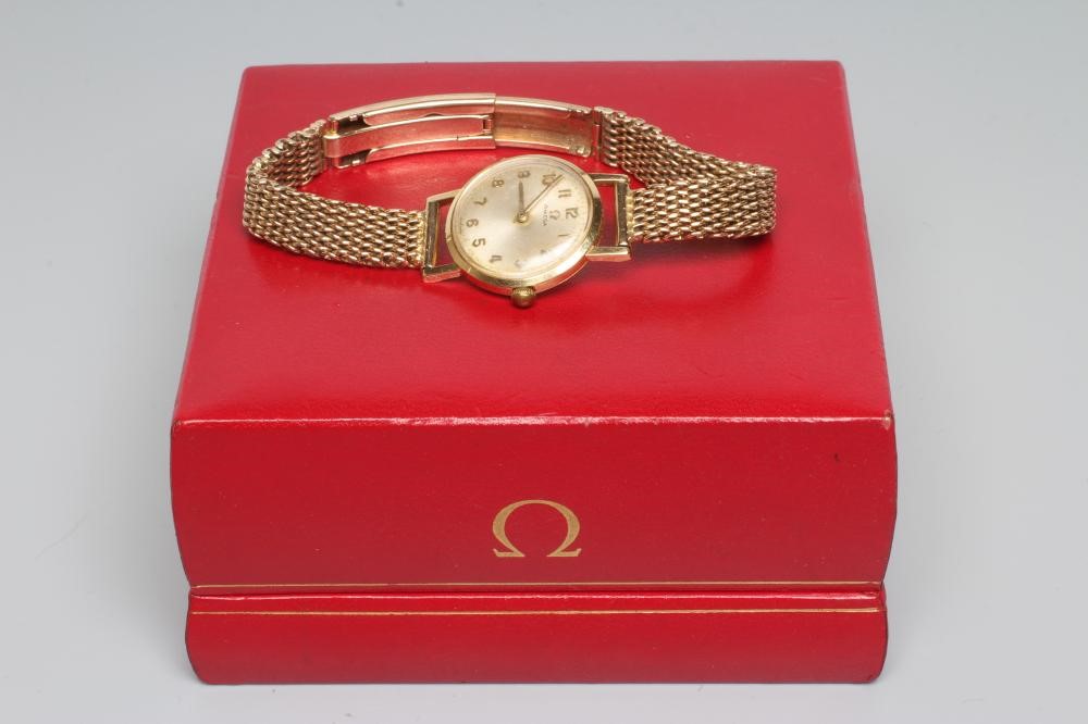 A LADY'S 18CT GOLD OMEGA WRISTWATCH Image