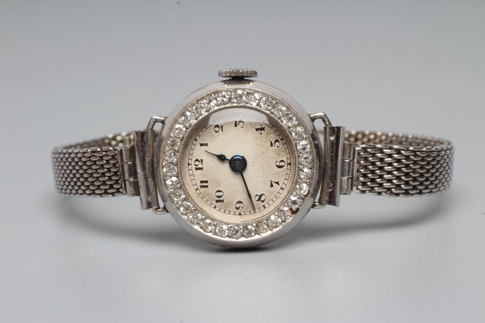 A DIAMOND AND PLATINUM COCKTAIL WATCH Image