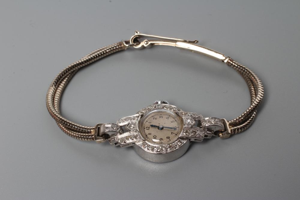 A 9CT WHITE GOLD AND DIAMOND COCKTAIL WATCH Image