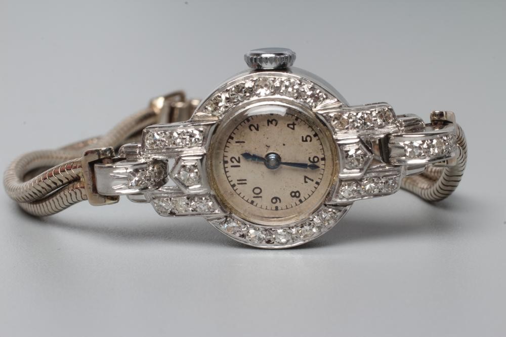 A 9CT WHITE GOLD AND DIAMOND COCKTAIL WATCH Image