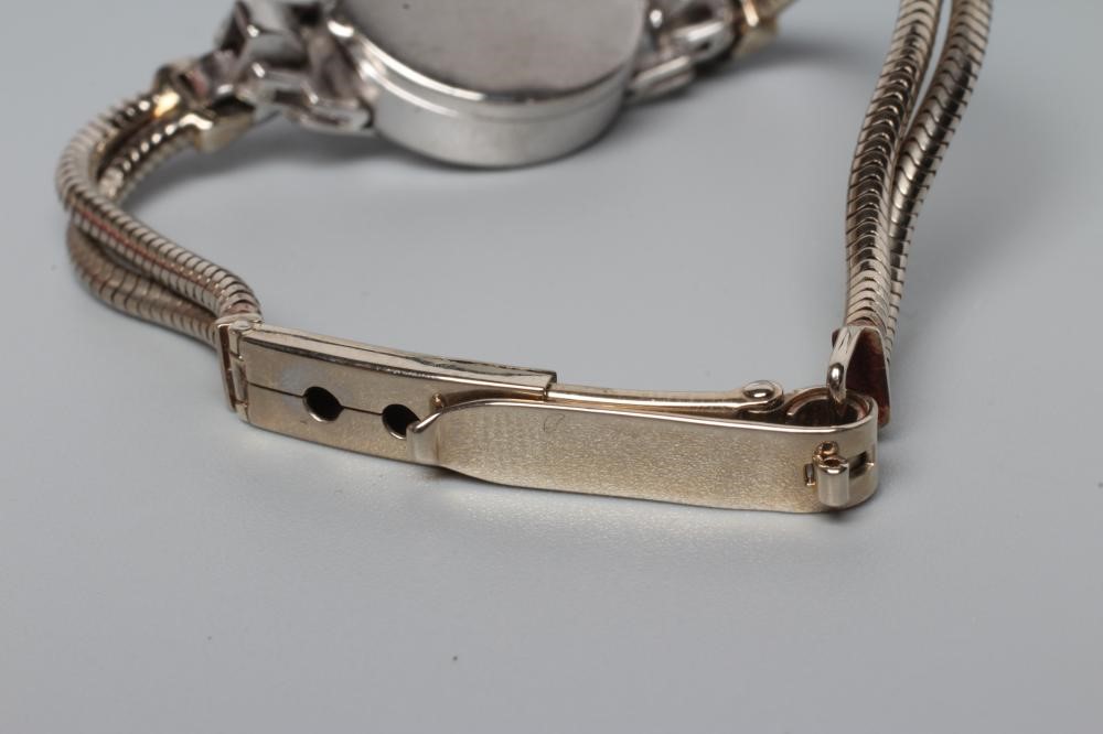 A 9CT WHITE GOLD AND DIAMOND COCKTAIL WATCH Image