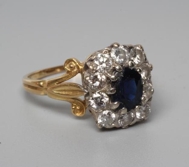 A SAPPHIRE AND DIAMOND CLUSTER RING Image