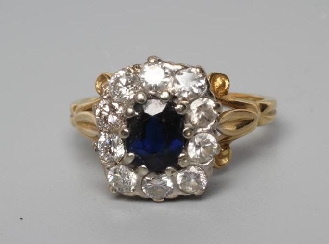 A SAPPHIRE AND DIAMOND CLUSTER RING Image