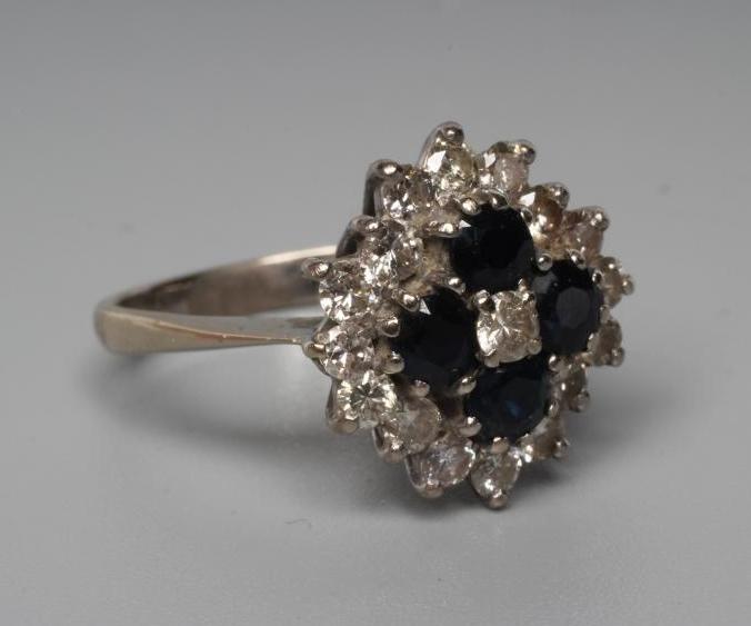 A SAPPHIRE AND DIAMOND CLUSTER RING Image