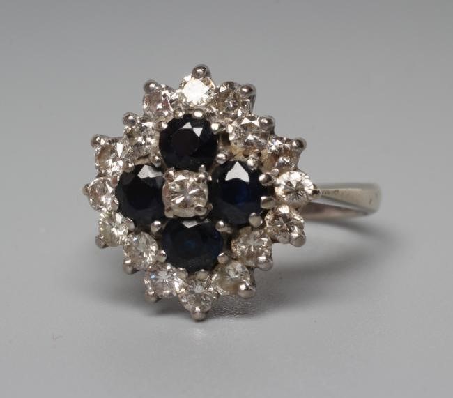 A SAPPHIRE AND DIAMOND CLUSTER RING Image