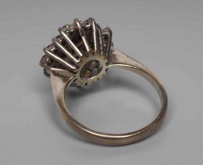 A SAPPHIRE AND DIAMOND CLUSTER RING Image