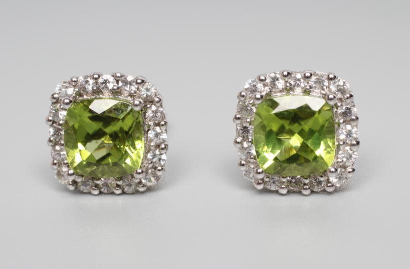 A PAIR OF PERIDOT AND DIAMOND CLUSTER EAR STUDS Image