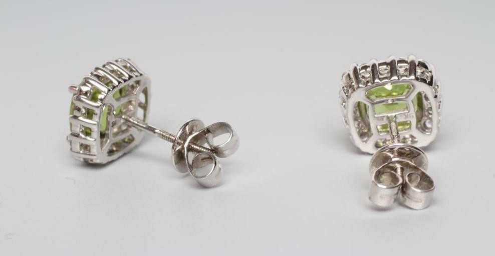 A PAIR OF PERIDOT AND DIAMOND CLUSTER EAR STUDS Image