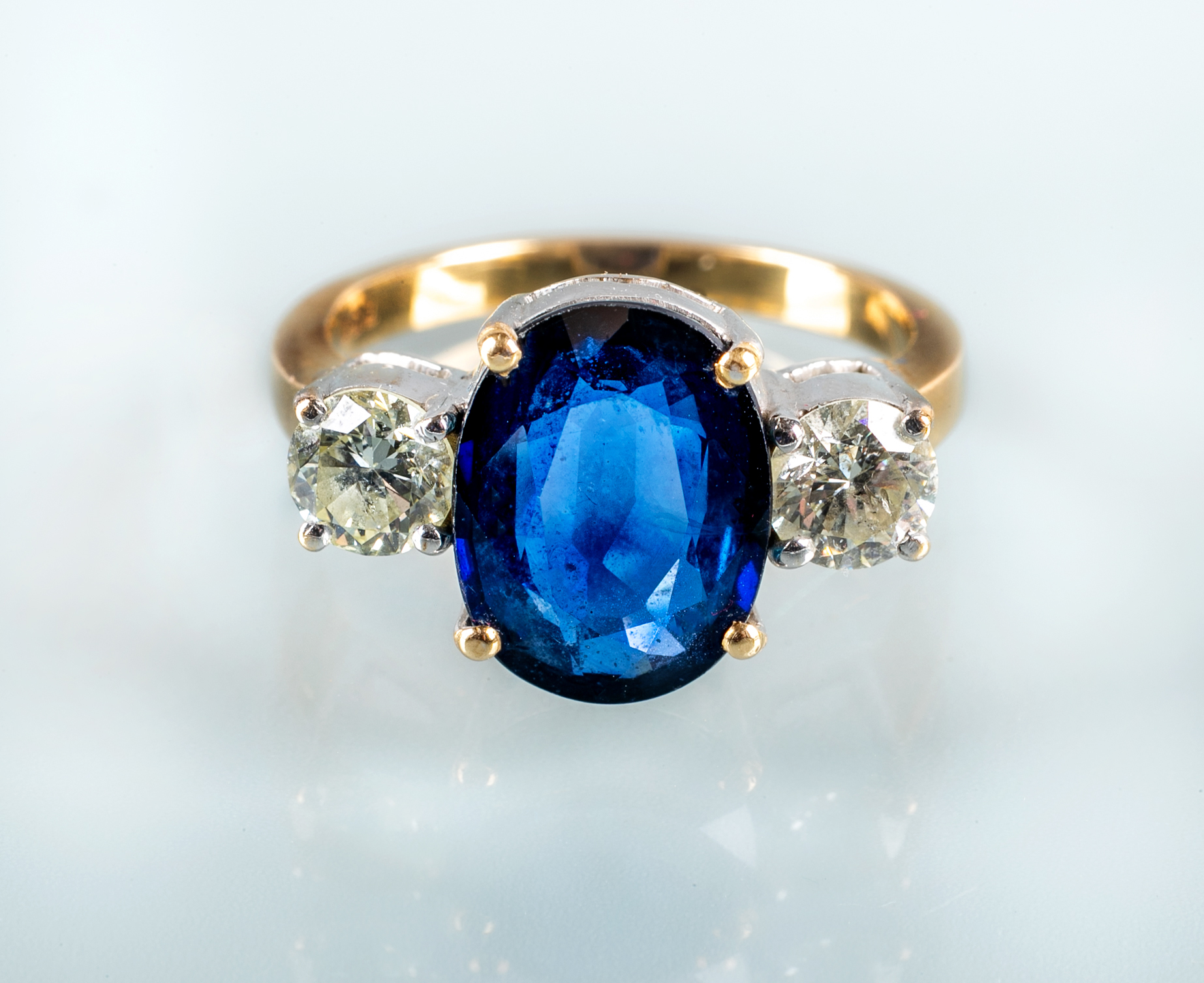 A THREE STONE SAPPHIRE AND DIAMOND RING Image
