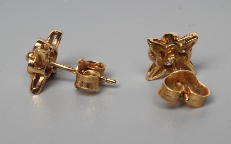 A PAIR OF DIAMOND EAR STUDS Image
