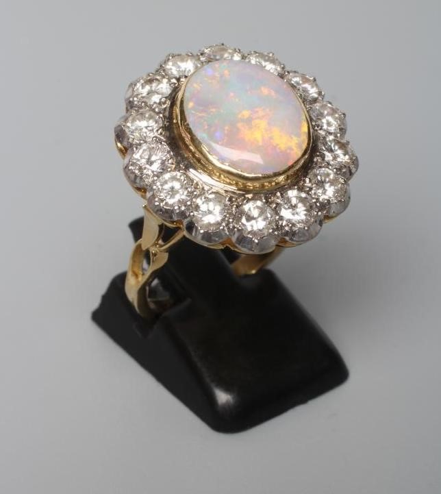 AN OPAL AND DIAMOND CLUSTER DRESS RING Image