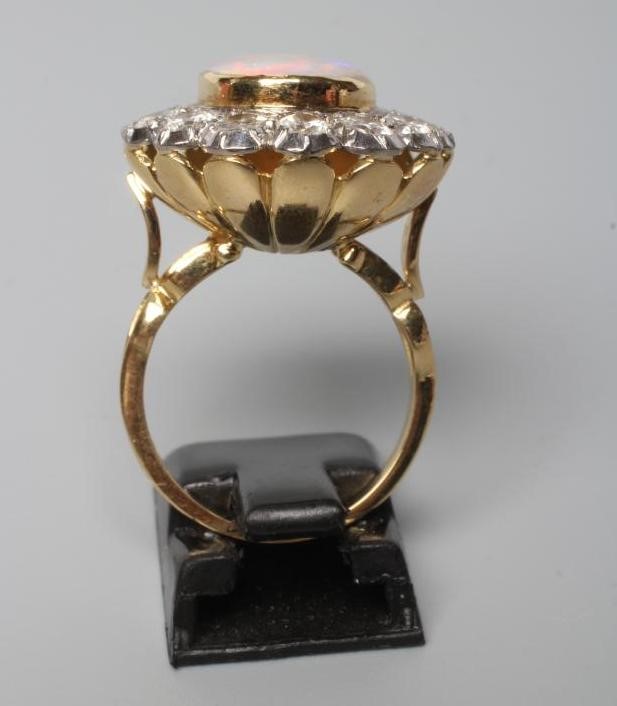 AN OPAL AND DIAMOND CLUSTER DRESS RING Image