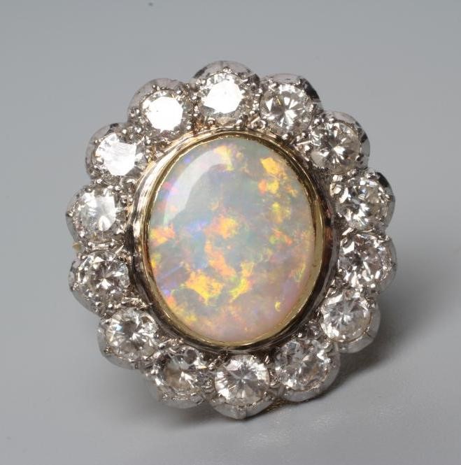 AN OPAL AND DIAMOND CLUSTER DRESS RING Image