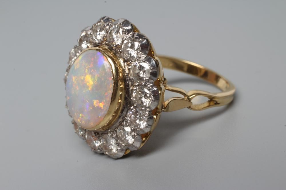 AN OPAL AND DIAMOND CLUSTER DRESS RING Image