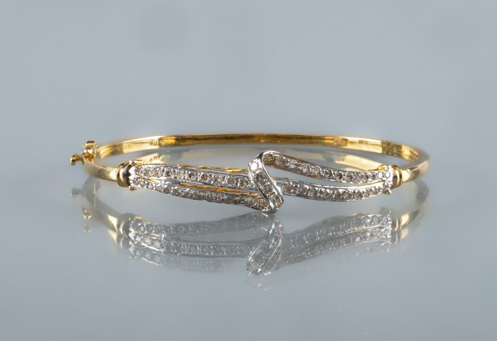 A DIAMOND STIFF HINGED BANGLE Image